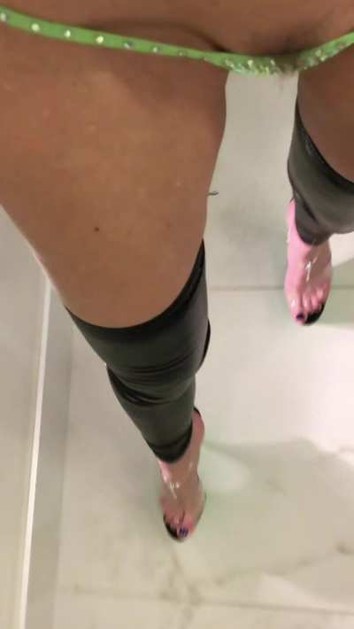 POV in sexy platforms, wet look leggings, and micro g-string with some pubes showing
