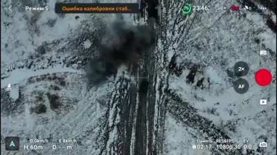 A Ukrainian ground drone, under Russian fire, attempts to evacuate a damaged heavy bomber drone  (music from the source).