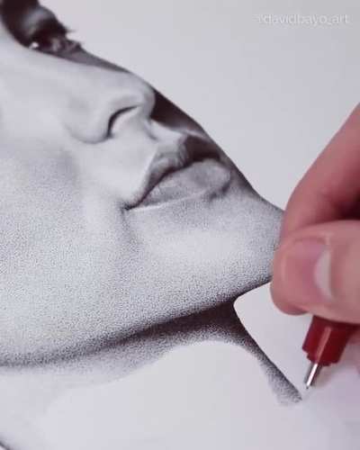 This person is an artist who specializes in pointillism for the art of dotting , what a masterpiece