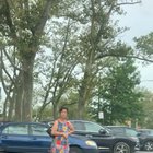 Lady standing in on a parking spot