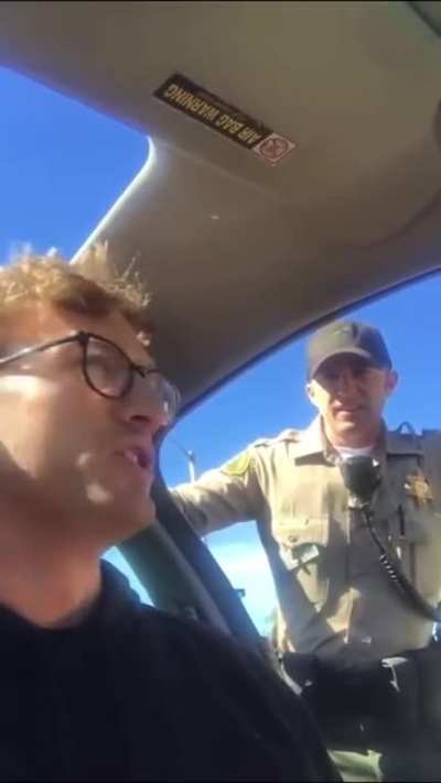 Cop on a power trip. Stops him for speeding and threatens to pepper spray him if he doesn’t exit his car for ‘safety’ reasons.