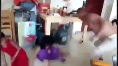 Chinese man beating up 3 young Uyghur girls who are forced to live with him by the government in attempt to become more 