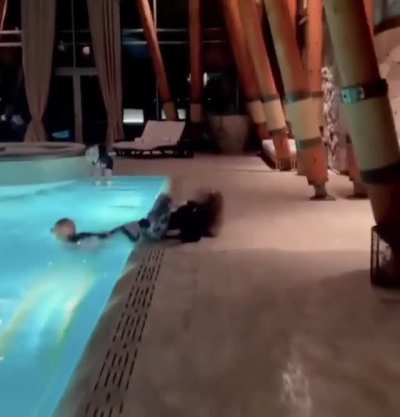 Pushing a girl on skates in the pool
