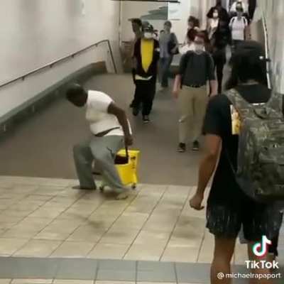 Guy poops in a workers mop bucket