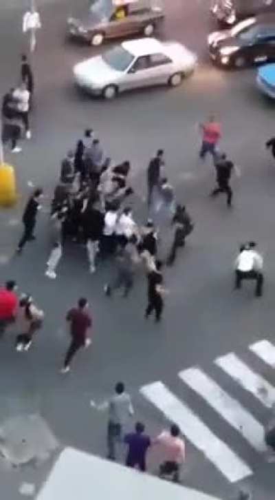 In Iran police threatens protestors with baton and shocker instead gets beaten up by protestors