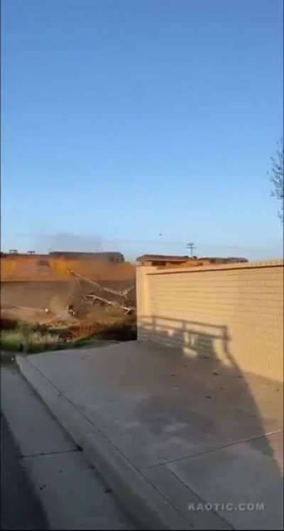 Train pulverizes a stalled out semi-truck hauling cars and SUVs. The driver escaped. You can see him running away at the beginning.
