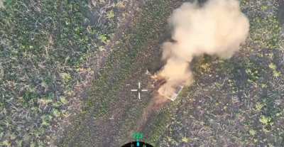 RU POV: Russian drone bombs an unmanned ground vehicle evacuating a wounded Ukrainian soldier. 