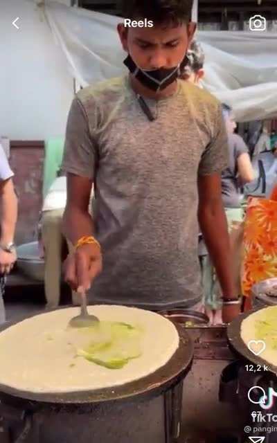 This guy is making a sort of crêpe