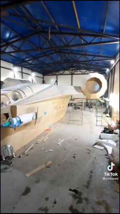 Man builds a Razor Crest ship out of wood in his garage.