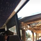 Bus almost makes it around a corner