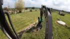 Taking down an old fence with heavy machinery