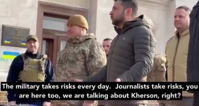 President Zelenskyy answers journalist Dmytro Komarov's question in Kherson, 