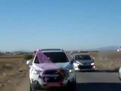 Guy shoots a fireworks on a wedding car, ends up exploding in his car.