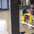 2 drunk guys floating in a piece of wall after flood