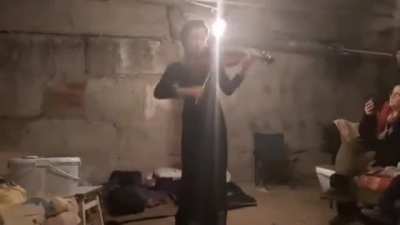 Violinist plays in Ukrainian bomb shelter as city above is shelled