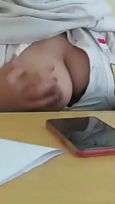 Asian nurse showing a boobie in public