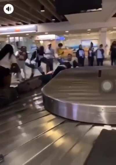 a fight breaks out at the airport