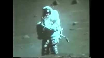A rare glimpse of the face of an astronaut during a moon EVA (wait for zoom in). Apollo 17's LMP Harrison 