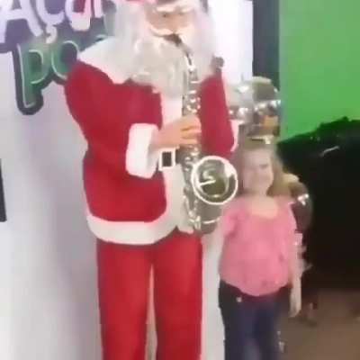 Little girl having fun with Mall Santa