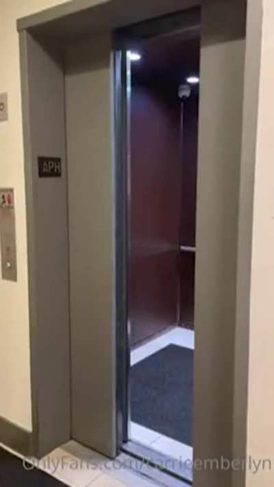 TS Carrie Emberlyn flashes her cock in a hotel hallway