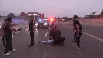 Photojournalist Attacked After Rollover Crash