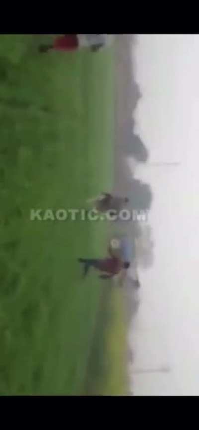 Dumbass tries to show off on a tractor. It nearly squashes him. The throttle gets stuck resulting in a bunch of other dumbasses chasing it trying to stop it.