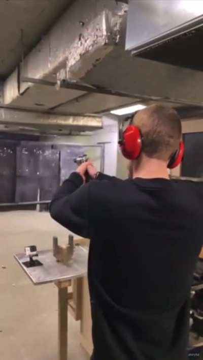 Guy almost taps his head with the second shot