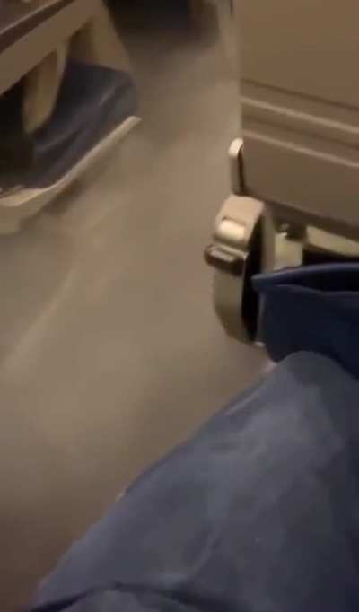 Fog in the aisle of a plane
