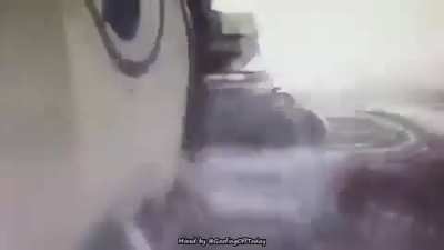 truck avoids a motorcycle but flattens a car