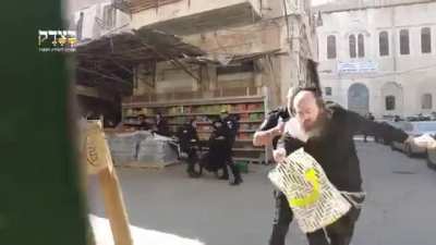 Israeli occupation and oppression police brutally attacking peaceful jews in Jerusalem.