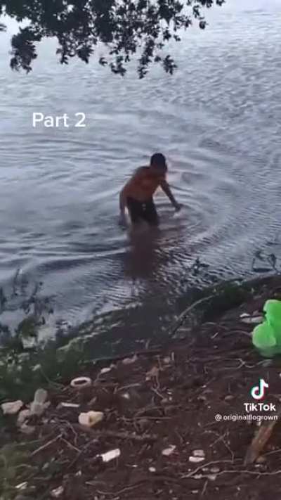 Gator almost makes a meal out of a man swimming across the water
