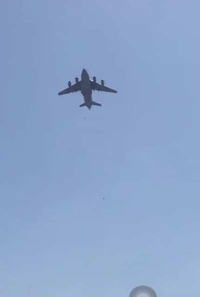 Desperate Afghans hanging onto an airplane during takeoff at Kabul Airport. Two people seen falling from the sky…