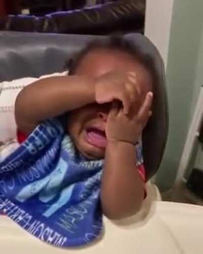 baby sees his father's new haircut