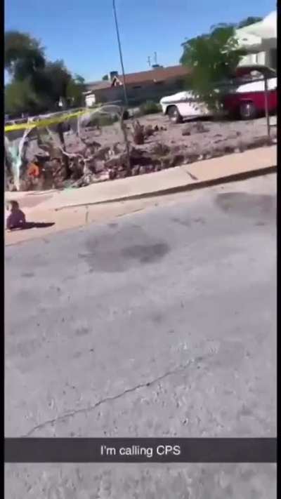 Guy walking his dog encounters a baby crawling onto the road