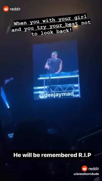 Woman twerks right behind couple at concert