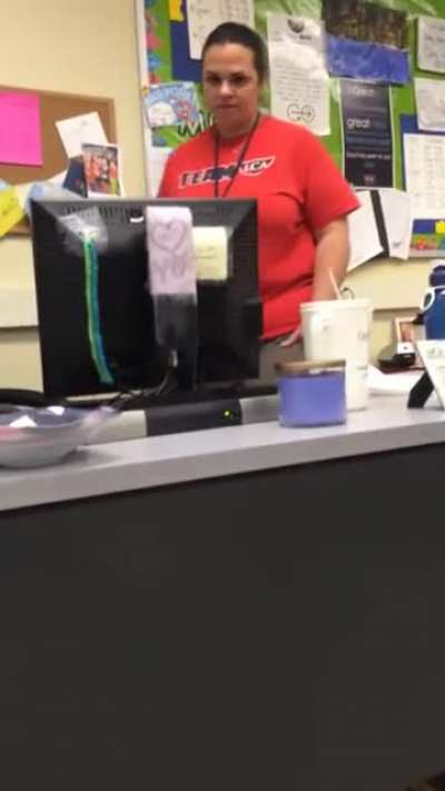 Student hides under desk and grabs teacher's ankle