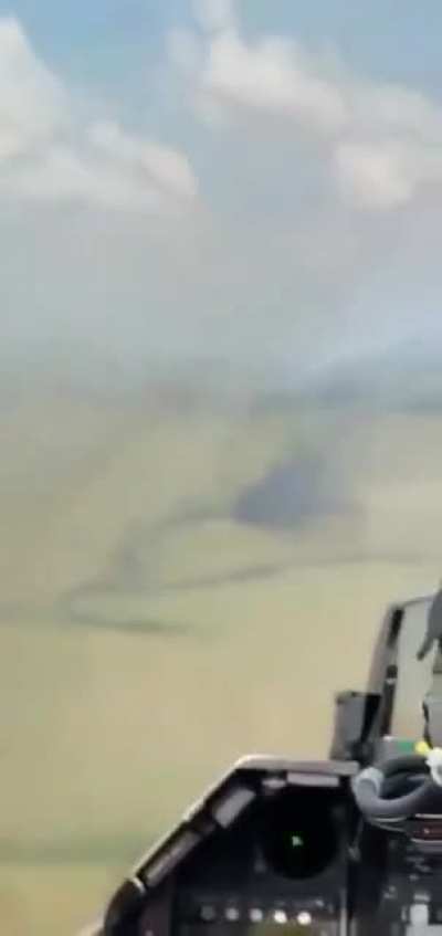 Venezuelan F-16 flys by burning plane it just shot down after illegal entering the airspace on March 28th.