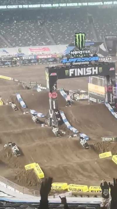 mad lad tosses his shirt and jumps onto the track