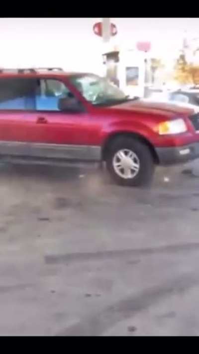 Dude tries to drift his suv around gas pumps