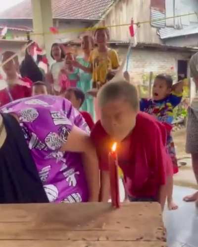 Competitive candle blowing at a birthday party?