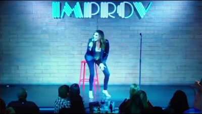 Female 'comedian' collapses on stage after joking about taking the vaccine, ends up with a fractured skull, audience laughs and thinks it's part of the act.