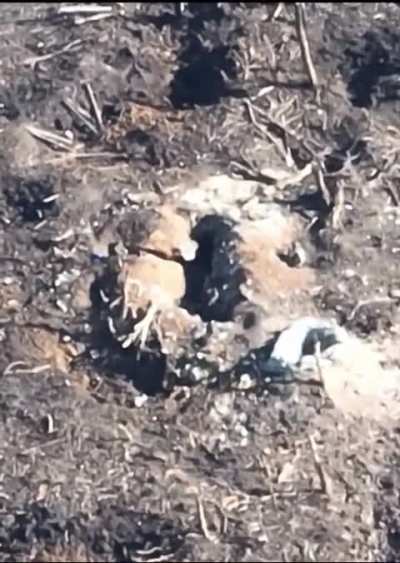 Ukrainian soldier flanks Russia trench position