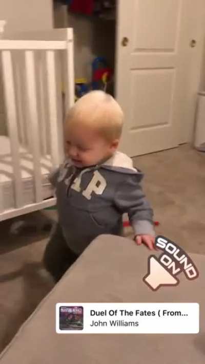 Toddler dramatically dies in lightsaber duel