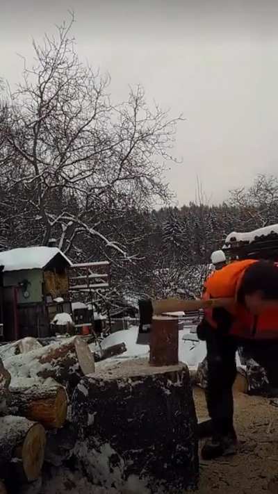 Man with no arms splits firewood