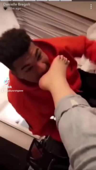 Lucky guy nibbling on Bhad Bhabies feet 