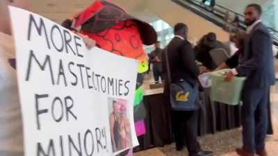 Anti-trans protestor rage baiting a trans advocate
