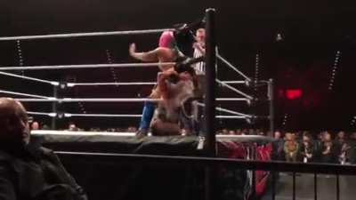 Asuka With a Stinkface to Dana Brooke.