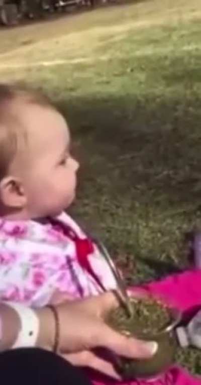 Baby tries herbal tea for the first time