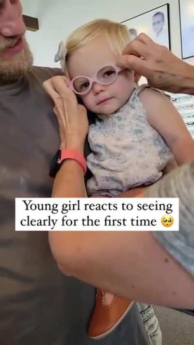 baby reacts to seeing clearly for the first