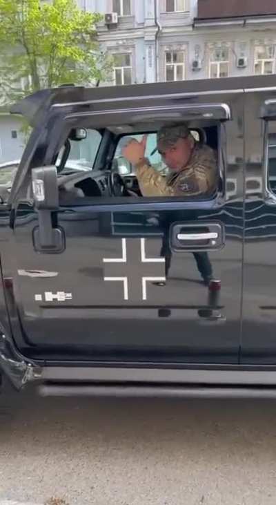 Ru pov: Ukrainian officer (allegedly a conscription officer) shows his vehicle with Balkenkreuz markings somewhere in Kiev